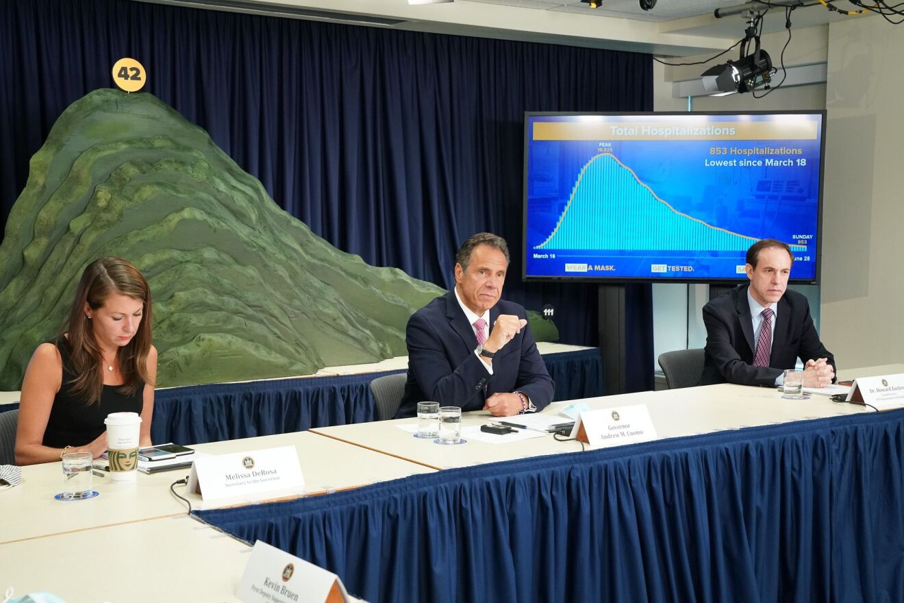 Gov. Andrew Cuomo holds his briefing in New York City in front of a plastic mountain sculpture symbolizing the state's efforts to fight COVID-19.